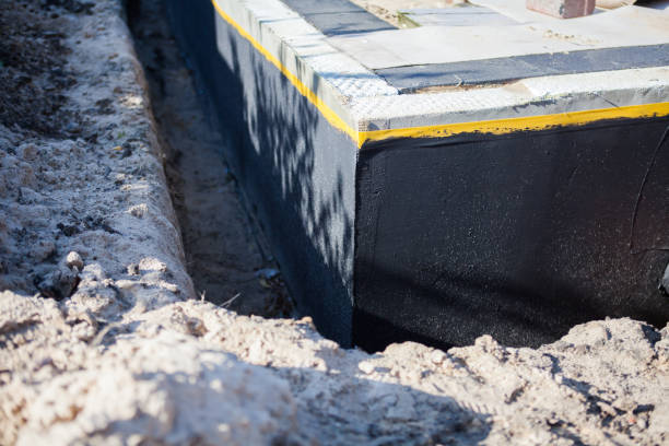 Professional Waterproofing technician working in Madison, GA